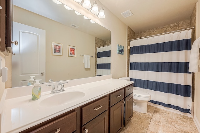 bathroom with a shower with curtain, vanity, tile patterned flooring, and toilet