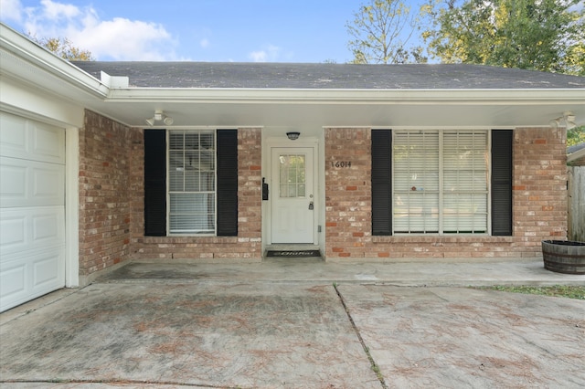 doorway to property featuring a garage