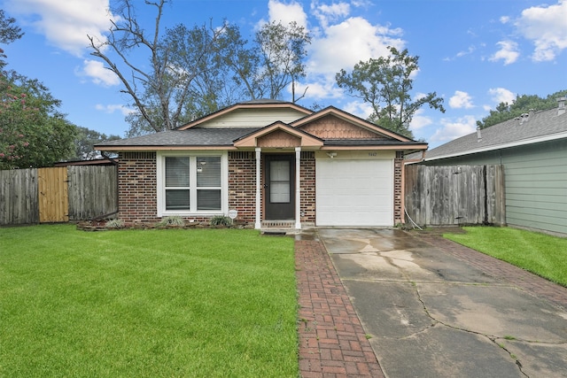 view of front facade with a front yard and a garage