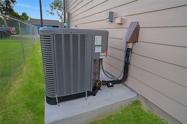 exterior details featuring wooden walls and central AC