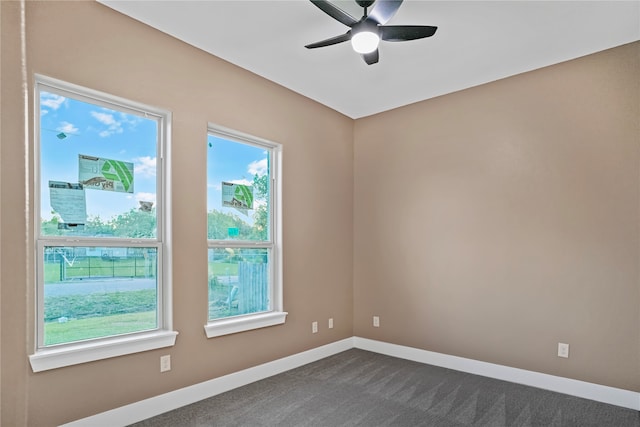 carpeted spare room with ceiling fan and a wealth of natural light