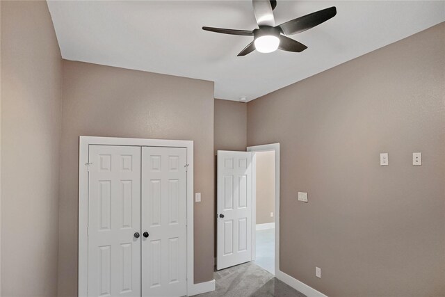725 A Ave, La Marque, TX 77568 - unfurnished bedroom with a closet, carpet floors, baseboards, and ceiling fan