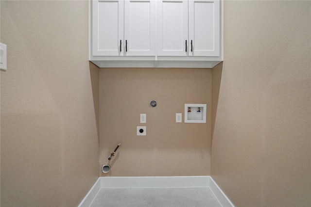 clothes washing area featuring washer hookup, light tile patterned floors, hookup for an electric dryer, hookup for a gas dryer, and cabinets