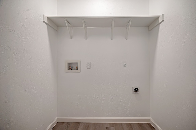 washroom featuring washer hookup, dark wood-type flooring, and hookup for an electric dryer