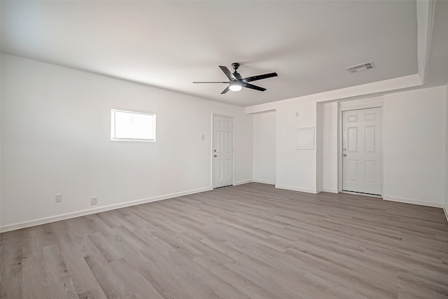 spare room featuring ceiling fan and light wood-type flooring