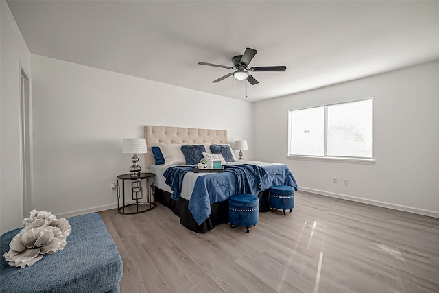 bedroom featuring light wood-type flooring and ceiling fan