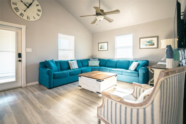 living room featuring wood-type flooring, high vaulted ceiling, and ceiling fan