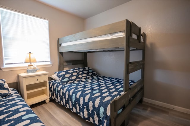 bedroom with wood-type flooring