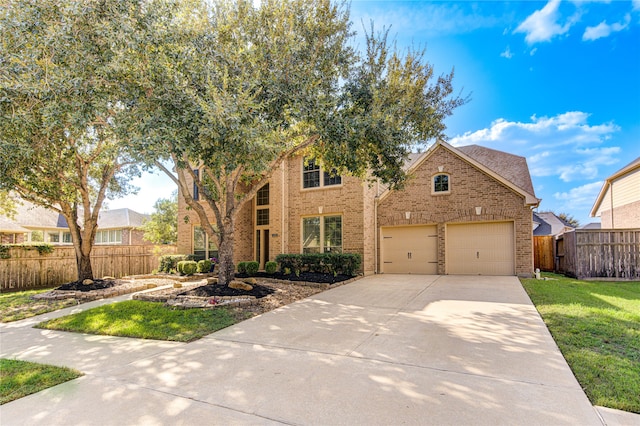 view of front of home featuring a garage and a front yard