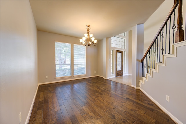 interior space featuring an inviting chandelier and hardwood / wood-style floors