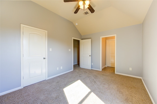 unfurnished bedroom featuring lofted ceiling, ceiling fan, and light colored carpet