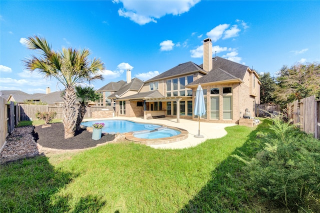 view of pool featuring a lawn and a patio