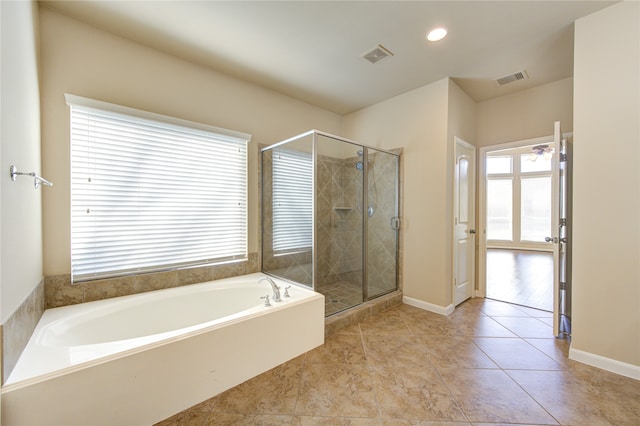 bathroom featuring independent shower and bath and tile patterned floors