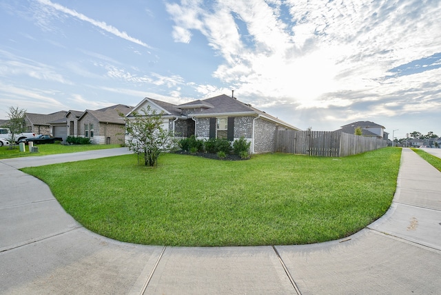 ranch-style house with a front lawn