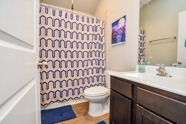 full bathroom featuring vanity, toilet, wood-type flooring, shower / tub combo, and vaulted ceiling