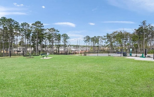 view of home's community featuring a lawn