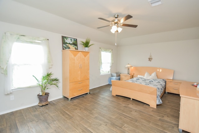 bedroom with wood-type flooring and ceiling fan