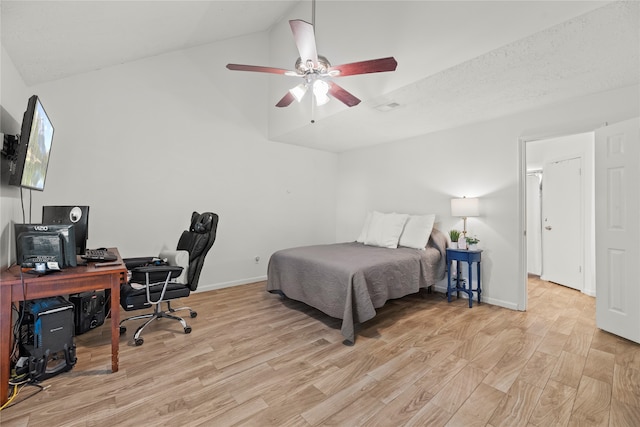 bedroom featuring vaulted ceiling, ceiling fan, and light hardwood / wood-style flooring