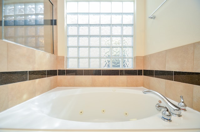 bathroom featuring a tub to relax in