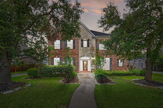 view of front of property with a lawn