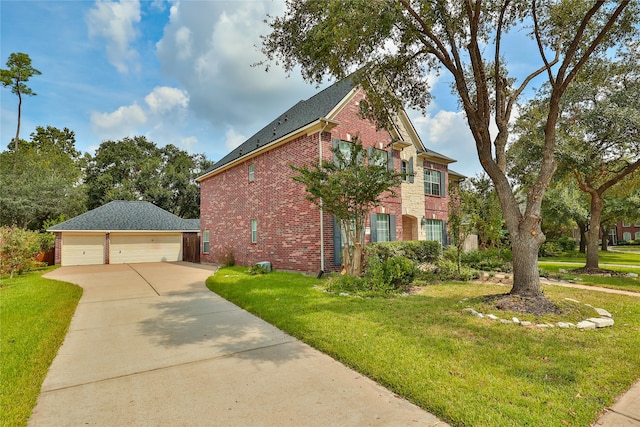 exterior space featuring a garage, a front lawn, and an outbuilding