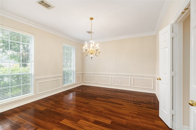 empty room featuring ornamental molding, a chandelier, and dark hardwood / wood-style flooring