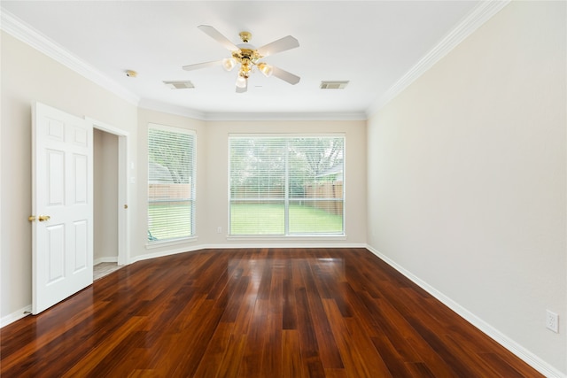 spare room featuring ornamental molding, dark hardwood / wood-style flooring, and ceiling fan