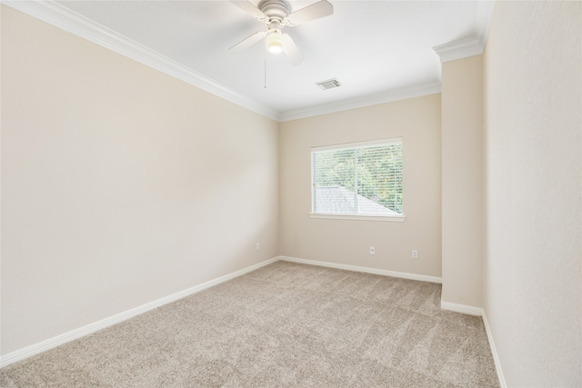 empty room with ceiling fan, crown molding, and light carpet