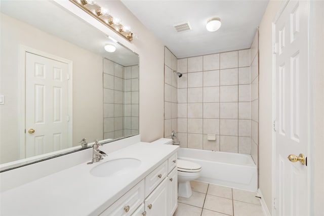 full bathroom with tile patterned flooring, vanity, toilet, and tiled shower / bath