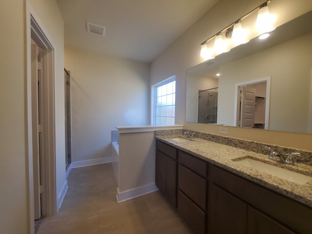 full bath featuring a garden tub, double vanity, a stall shower, and a sink