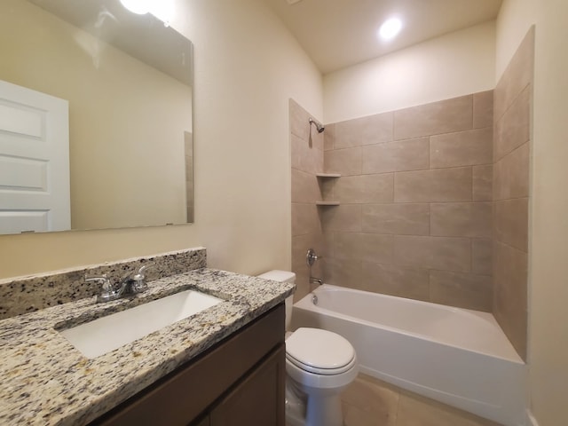 bathroom featuring shower / washtub combination, vanity, toilet, and tile patterned floors