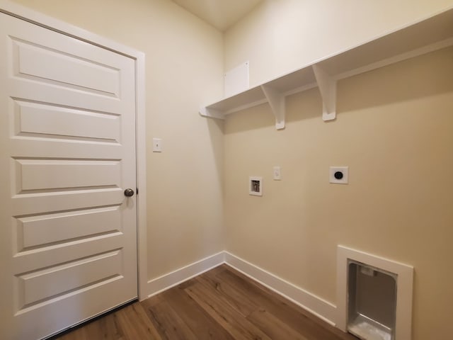 laundry area with laundry area, baseboards, dark wood-type flooring, hookup for a washing machine, and hookup for an electric dryer