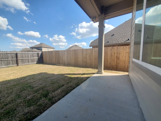 view of yard featuring a patio and a fenced backyard