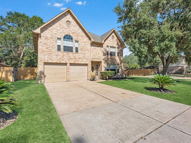 view of front of house featuring a front yard and a garage