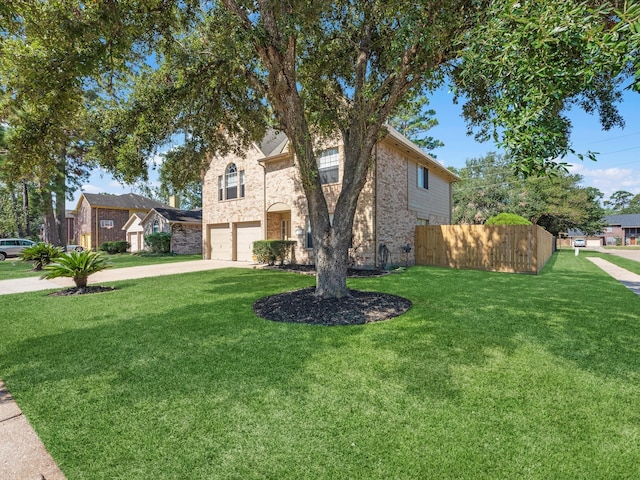 view of front of home featuring a garage and a front yard