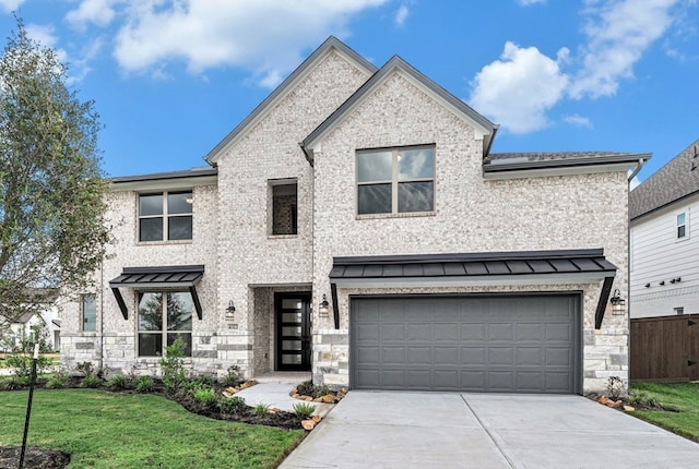 view of front facade featuring a garage and a front yard