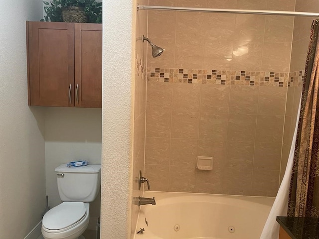 bathroom with shower / bath combo with shower curtain and toilet