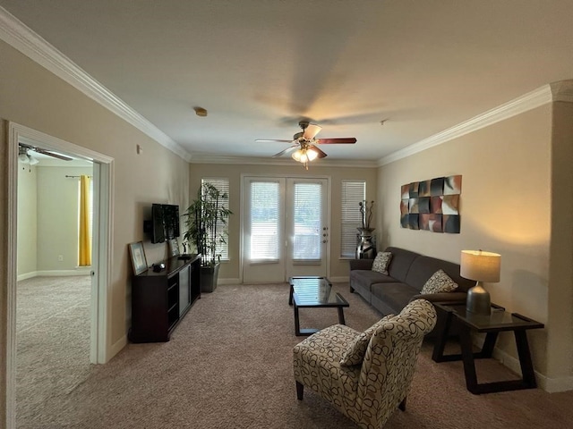 carpeted living room with ceiling fan and crown molding