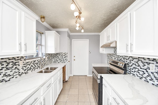 kitchen featuring stainless steel electric stove, white cabinets, sink, and track lighting