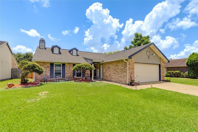 view of front facade with a front yard and a garage