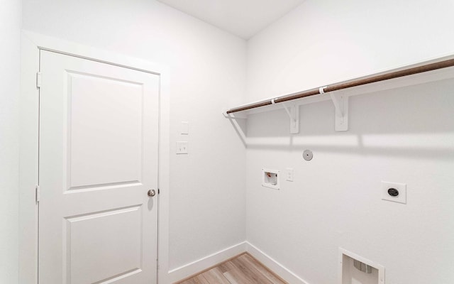 washroom with electric dryer hookup, gas dryer hookup, hookup for a washing machine, and light wood-type flooring