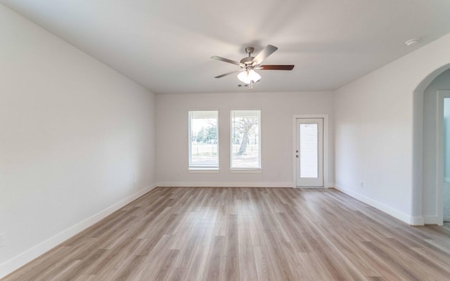 empty room featuring ceiling fan and light hardwood / wood-style floors