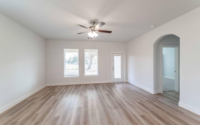 spare room with ceiling fan and light hardwood / wood-style flooring