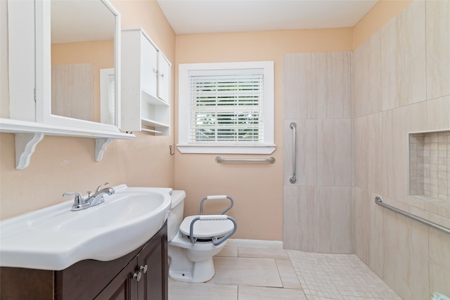 bathroom featuring walk in shower, vanity, tile patterned flooring, and toilet