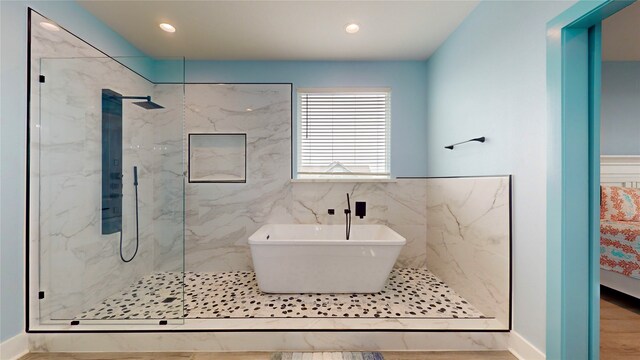 846 Alma, Crystal Beach, TX 77650 - bathroom with a marble finish shower, a soaking tub, recessed lighting, and baseboards