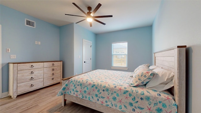 bedroom featuring light hardwood / wood-style floors and ceiling fan