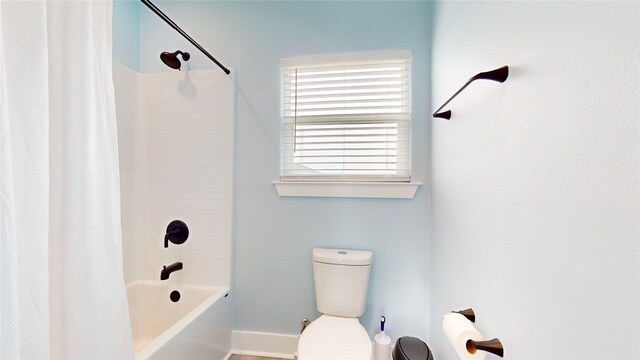 846 Alma, Crystal Beach, TX 77650 - full bathroom featuring toilet, baseboards, and shower / bath combo with shower curtain