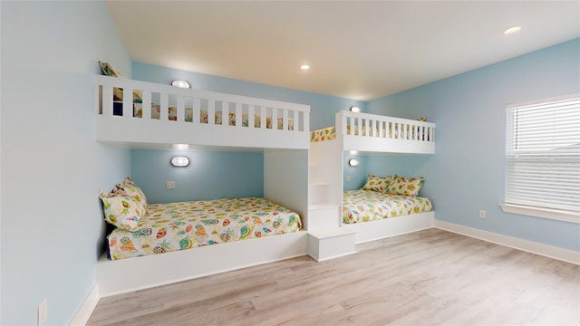 bedroom with light hardwood / wood-style flooring