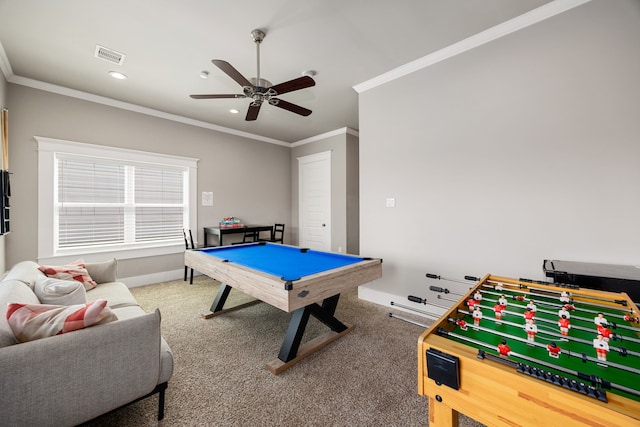 playroom with ceiling fan, ornamental molding, and carpet