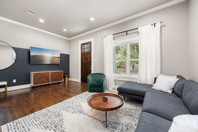 living room featuring dark hardwood / wood-style floors and ornamental molding